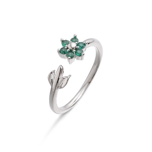 Detail showing the adjustable silver floral ring with green zircon stones and leaf accents