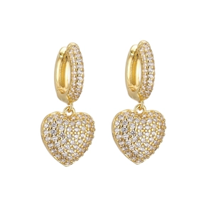 Close-up of gold heart drop earrings featuring micro-pave cubic zirconia on white background