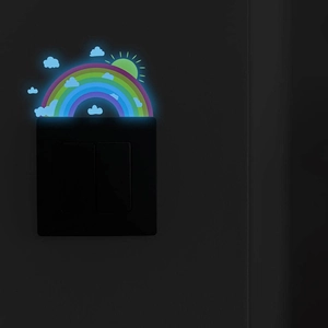 Glow-in-the-dark rainbow and clouds wall sticker illuminating a dark bedroom wall