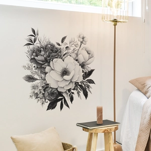 Sticker mural floral noir et blanc avec pivoines et roses dans une chambre chaleureuse
