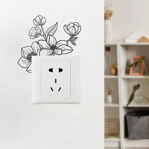 Minimalist black sketch floral wall decal surrounding a white light switch