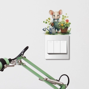 Detailed view of cartoon mouse wall sticker applied above a white light switch panel