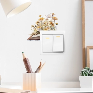 Stickers muraux marguerites sortant d'un livre au-dessus d'un interrupteur mural