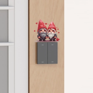 Cartoon Valentine gnomes wall stickers with red heart hats placed above a light wood switch