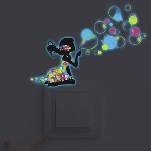 Luminous wall sticker of a girl silhouette blowing glowing bubbles on a light switch
