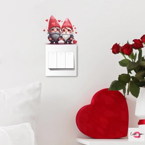 Close-up of Valentine gnome wall stickers applied above a white light switch with hearts