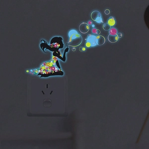 Glow in the dark wall sticker featuring a girl silhouette blowing colorful luminous bubbles
