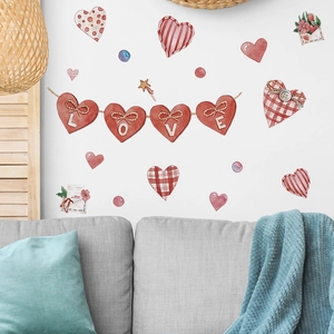 Watercolor heart wall stickers and LOVE banner displayed on a clean white wall