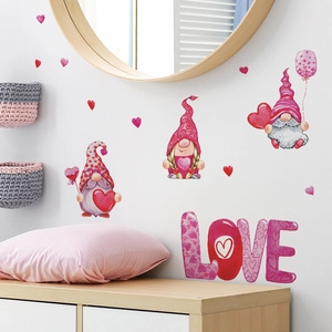 Detail of Valentine gnomes and LOVE wall stickers on a white wall in a cozy room