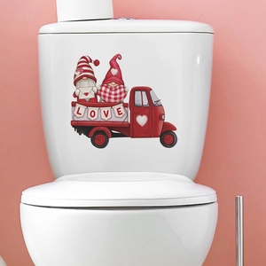 Valentine's Day gnomes in a red truck decal on a white ceramic toilet tank cover