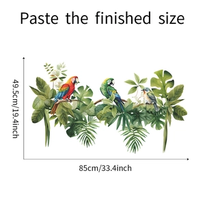 Détail de stickers muraux perroquets et feuilles monstera avec dimensions de finition