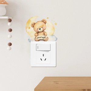 Detail of cartoon teddy bear on moon light switch wall sticker with good night text