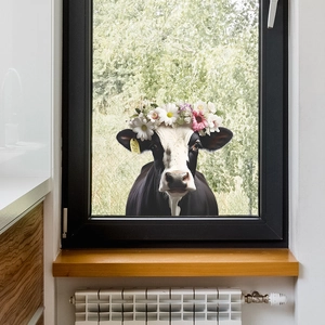 Detailed realistic cartoon cow wall sticker with floral wreath on a home window surface