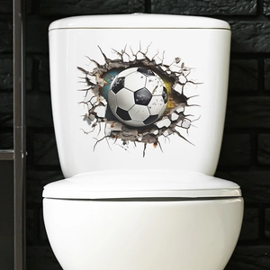 Detailed view of a 3D soccer ball cracking through a wall sticker on a toilet lid