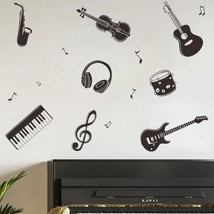 Black silhouette music wall decals with guitar, piano and notes for studio decor