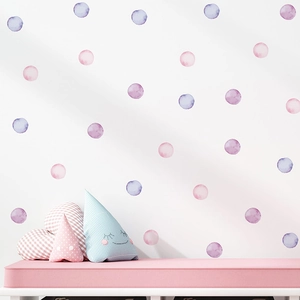 Watercolor polka dot wall stickers for nursery decor in soft pink and purple tones