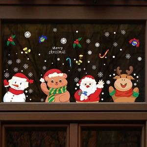 Christmas window decals with Santa, snowman, and reindeer on a rustic wooden glass window