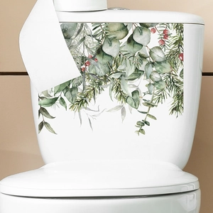 Christmas plant stickers with eucalyptus and berries on a white ceramic toilet tank