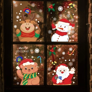 Cartoon Christmas window stickers featuring Santa Claus, reindeer, and bear on glass panel