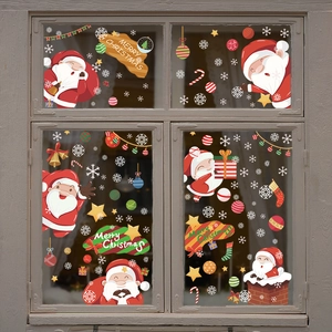 Christmas static window clings with Santa Claus and snowflakes on glass window pane