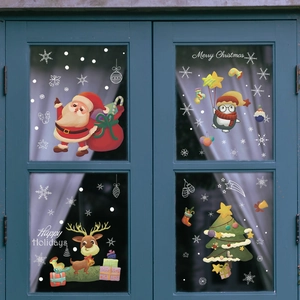 Christmas window stickers featuring Santa, penguin, and tree on glass window decoration