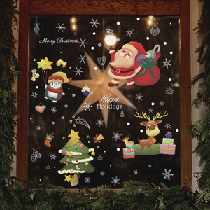 Christmas window stickers with Santa, reindeer, penguins and festive trees on glass