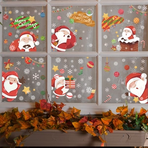 Christmas window stickers featuring Santa Claus and snowflakes for festive home decoration