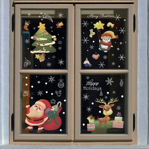 Detail of Christmas window clings featuring Santa Claus, reindeer, penguin and snowy tree
