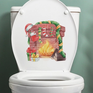 Christmas stocking and fireplace stickers on a white toilet lid for home decoration