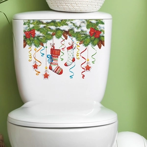 Autocollant WC de Noël avec branches de sapin, neige et ornements de fête rouges