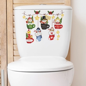 Christmas snowman and deer stickers on toilet tank with Merry Christmas festive design