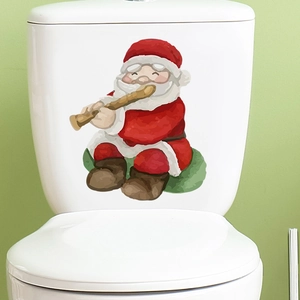 Detail of cartoon Santa playing flute wall sticker applied on a white toilet tank