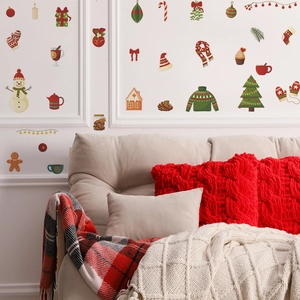 Christmas wall stickers featuring snowman and tree on white wall with festive sofa decor