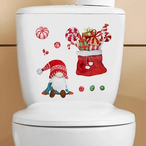 Detailed close-up of festive Christmas Gnome stickers applied to a ceramic toilet tank surface
