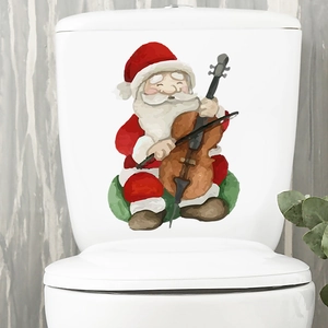 Cartoon Santa playing cello decorative wall sticker applied on a white toilet tank