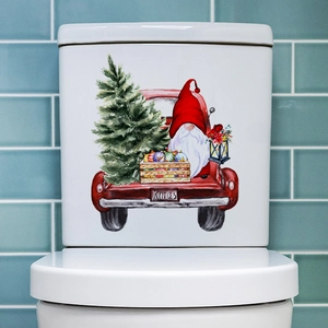 Détail d'autocollant mural de gnome de Noël et camion rouge sur le couvercle des toilettes