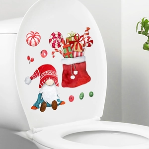 Christmas gnome wall stickers with candy bag on a white toilet lid for home holiday decor
