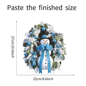 Detail showing the 27x22cm Christmas snowman wreath with blue bow and festive decorations