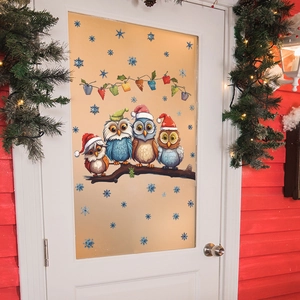 Christmas window stickers with cute owls on branch and snowflakes on glass door