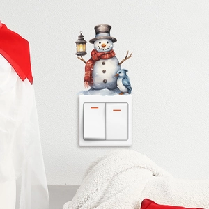 Close-up of a cute snowman wall sticker with a blue bird on a white light switch decor