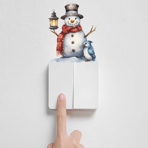 Cute Christmas snowman and penguin wall sticker applied above a light switch
