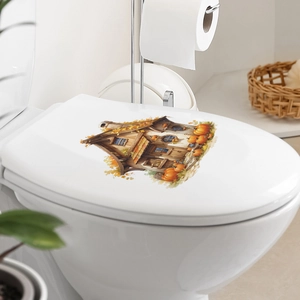 Sticker mural maison citrouille sur abattant WC blanc avec motifs chaleureux de style campagne