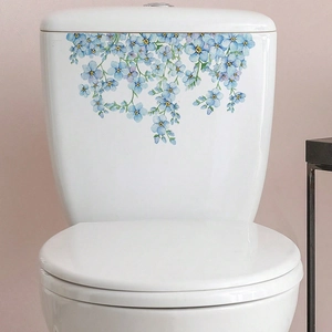 Watercolor blue flower decal for toilet tank decoration on white ceramic surface