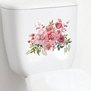 Tropical watercolor pink flower wall decals applied on a white toilet tank surface