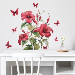 Tropical red hibiscus wall decals and butterflies on a minimalist white living room wall