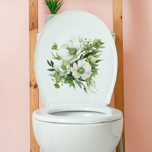 Detail view of floral wall stickers with white flowers and green leaves on toilet lid