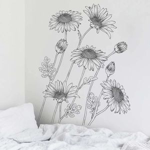 Detail showing hand-drawn daisy floral wall stickers in minimalist black line art style