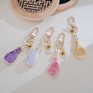 Handmade Chinese Pipa bag pendants in four colors with embroidery and crystal details