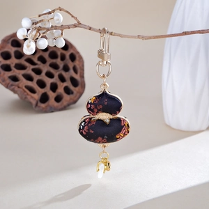 Traditional Chinese gourd charm with floral embroidery and white ring detail for bags