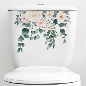 Detail of watercolor floral toilet stickers with eucalyptus leaves on white tank surface